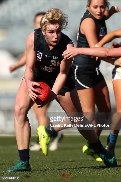 Celine Moody of the Blues runs with the ball during the round 10 VFLW match between Carlton Blues and Williamstown Seagulls at Ikon Park on July 15,...