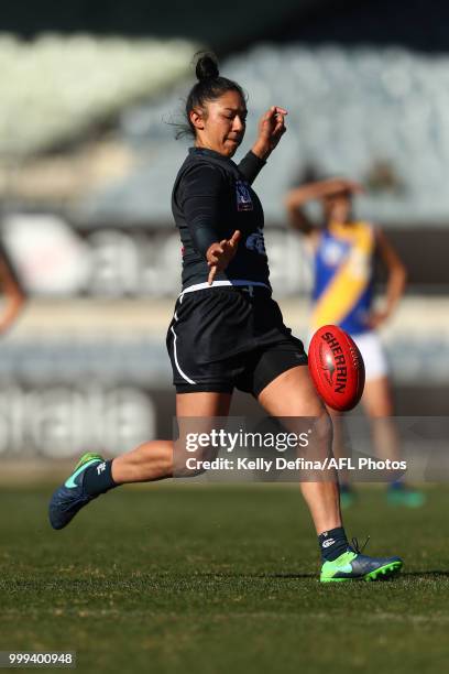 Darcy Vescio of the Blues kicks the ball during the round 10 VFLW match between Carlton Blues and Williamstown Seagulls at Ikon Park on July 15, 2018...