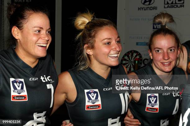 Sarah Last, Sarah Hosking and Kimberley Cunico of the Blues sing the song during the round 10 VFLW match between Carlton Blues and Williamstown...