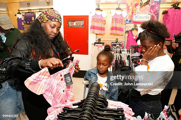 Claudinette Jean, Farah Maurice and guest attend a charity shopping spree at Kmart on May 18, 2010 in New York City.