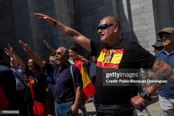 Far right-wing supporters do fascist salutes during a gathering at El Valle de los Caidos under the slogan 'Don't touch the valley' on July 15, 2018...