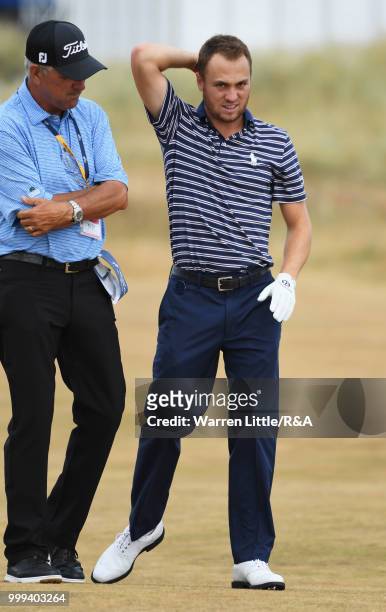 Justin Thomas of the United States talks with his father Mike Thomas while practicing during previews to the 147th Open Championship at Carnoustie...
