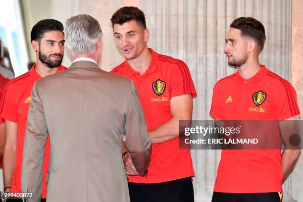 King Philippe - Filip of Belgium congratulates Belgium's team players midfielder Yannick Carrasco, midfielder Thomas Meunier and forward Adnan...