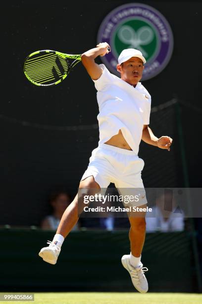 Chun Hsin Tseng of Taiwan returns against Jack Draper of Great Britain during the Boys' Singles final on day thirteen of the Wimbledon Lawn Tennis...