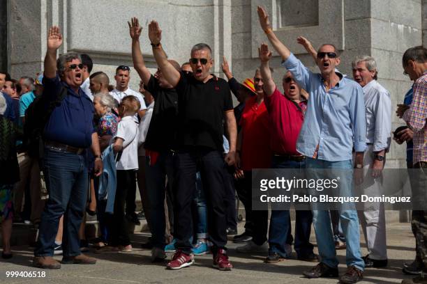 Far right-wing supporters do fascist salutes during a gathering at El Valle de los Caidos under the slogan 'Don't touch the valley' on July 15, 2018...