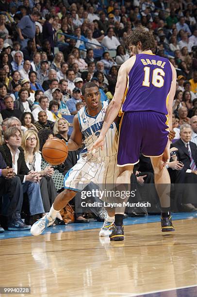 Chris Paul of the New Orleans Hornets drives the ball against Pau Gasol of the Los Angeles Lakers on March 29, 2010 at the New Orleans Arena in New...