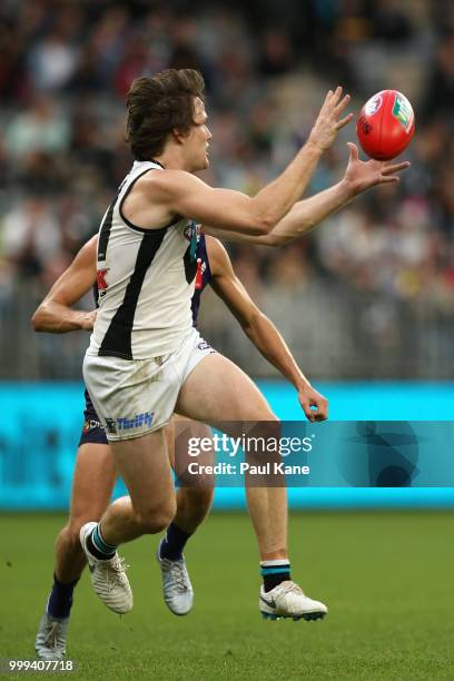 Jared Polec of the Power marks the ball during the round 17 AFL match between the Fremantle Dockers and the Port Adelaide Power at Optus Stadium on...