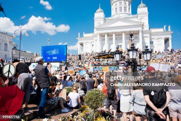 Protesters gather on the Senate Square at the end of the so-called "Helsinki Calling" march to defend the human rights, freedom of speech and...