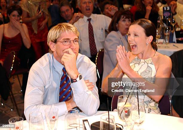 Jason Akermanis of the Brisbane Lions and his partner Megan Legge celebrate winning the AFL Brownlow Medal during the presentation at the Gabba in...