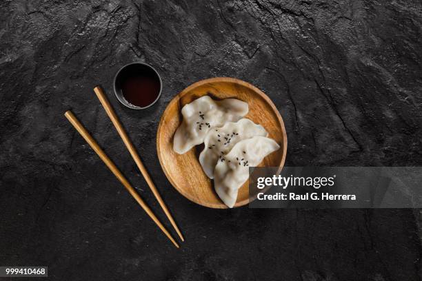 plate of asian gyoza dumplings with soy sauce - dikarya stock pictures, royalty-free photos & images