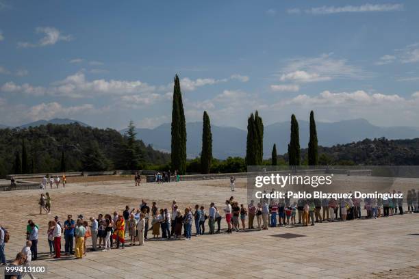 People queue to enter the El Valle de los Caidos monument during a gathering under the slogan 'Don't touch the valley' on July 15, 2018 near San...