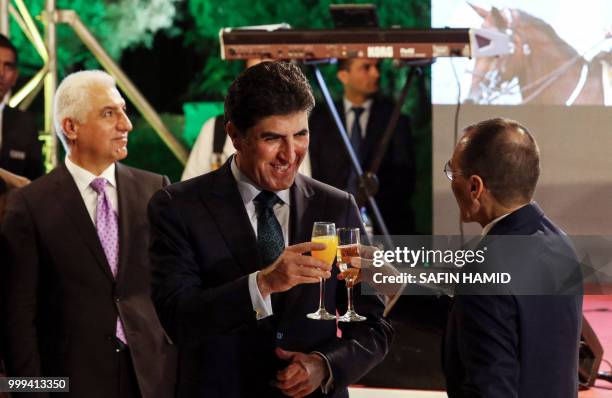 Dominique Mas , the French Consul General in Arbil, and Nechirvan Barzani , Prime Minister of Iraq's Kurdistan Regional Government raise toast...