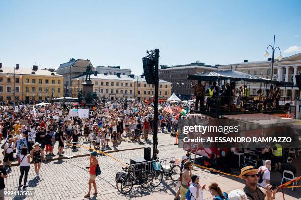 Protesters gather on the Senate Square at the end of the so-called "Helsinki Calling" march to defend the human rights, freedom of speech and...