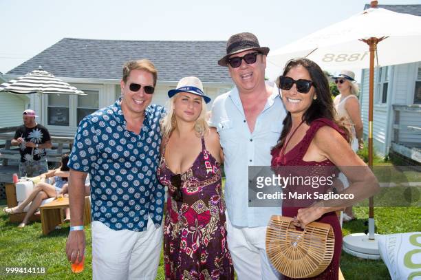 Grant Wilfley, Anna Kassar, Salvatore Piazzolla and Lynn Scotti attend the Modern Luxury + The Next Wave at Breakers Montauk on July 14, 2018 in...