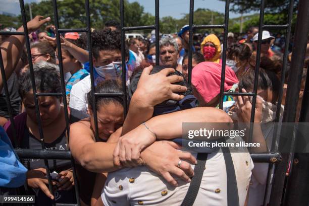 July 2018, Nicaragua, Managua: A student hugs his family upon his arrival at the Nicaraguan Cathedral. During the siege of a church in Nicaragua,...