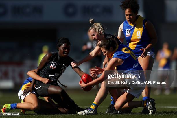 Akec Chuot of the Blues and Chloe Portelli of the Seagulls compete for the ball during the round 10 VFLW match between Carlton Blues and Williamstown...