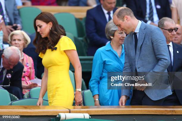 Catherine, Duchess of Cambridge and Prince William, Duke of Cambridge pass British Prime Minister Theresa May and her husband Philip May as they...