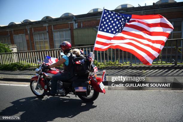 Harley Davidson biker drives with a dog on July 15, 2018 in Tours during a parade at the American Tours Festival.