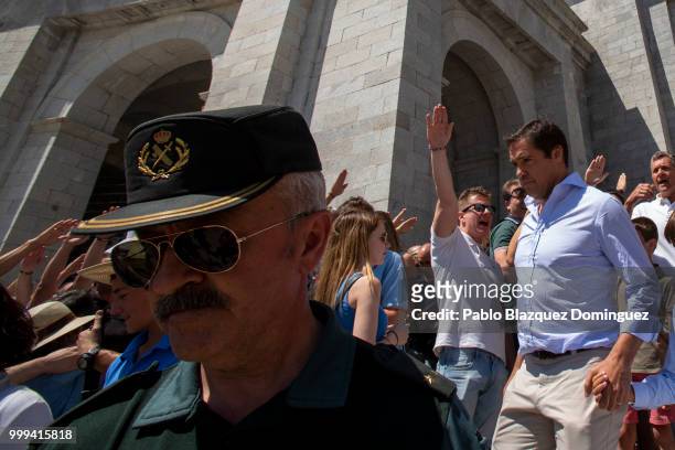 Luis Alfonso de Borbon who is great-grandson of Francisco Franco leaves the El Valle de los Caidos monument as people do fascists salutes during a...