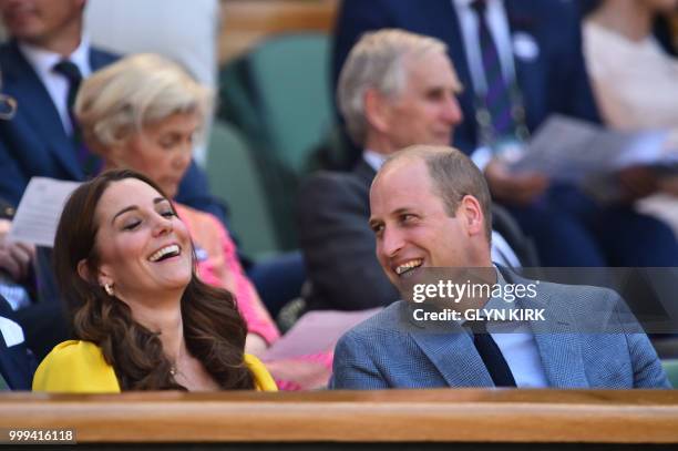 Britain's Catherine, Duchess of Cambridge jokes with her husband Britain's Prince William, Duke of Cambridge in the Royal Box before South Africa's...