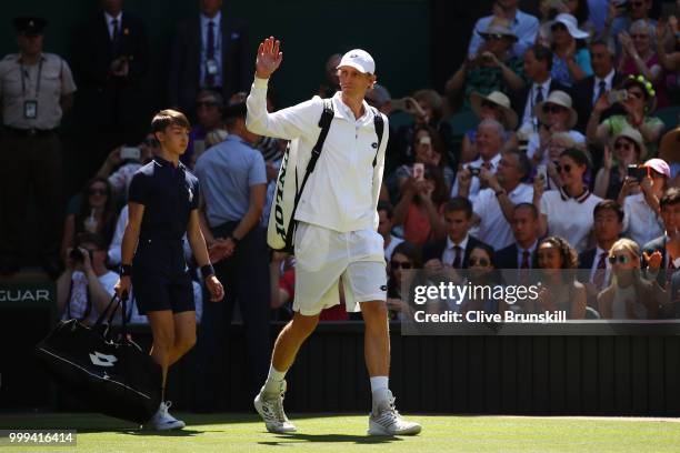 Kevin Anderson of South Africa waves as he walks out onto Centre Court ahead of the Men's Singles final against Novak Djokovic of Serbia on day...