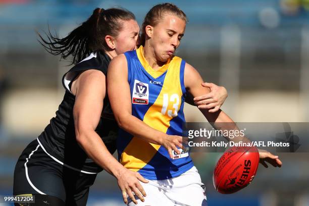 Nikki Wallace of the Seagulls is tackled by Kristi Harvey of the Blues during the round 10 VFLW match between Carlton Blues and Williamstown Seagulls...