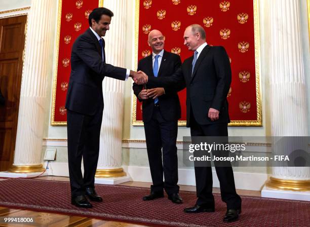 Amir of Qatar Sheikh Tamim bin Hamad Al Thani, FIFA president Gianni Infantino and President of Russia Valdimir Putin participate in a handover...