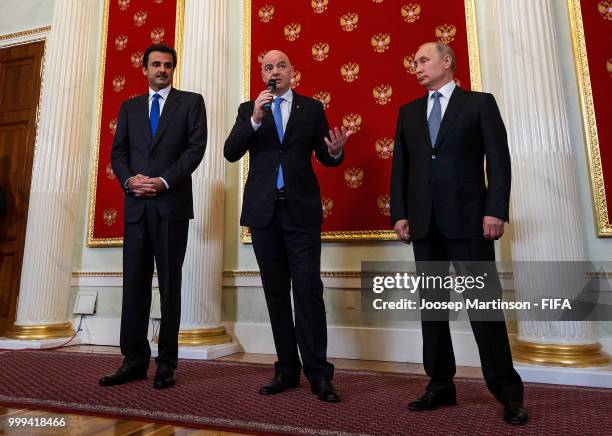 Amir of Qatar Sheikh Tamim bin Hamad Al Thani, FIFA president Gianni Infantino and President of Russia Valdimir Putin participate in a handover...