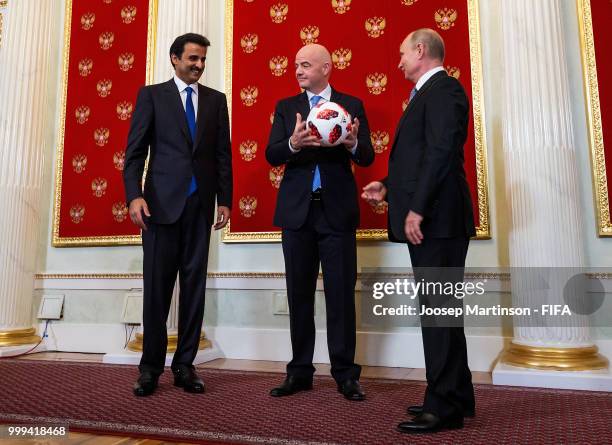 Amir of Qatar Sheikh Tamim bin Hamad Al Thani, FIFA president Gianni Infantino and President of Russia Valdimir Putin participate in a handover...