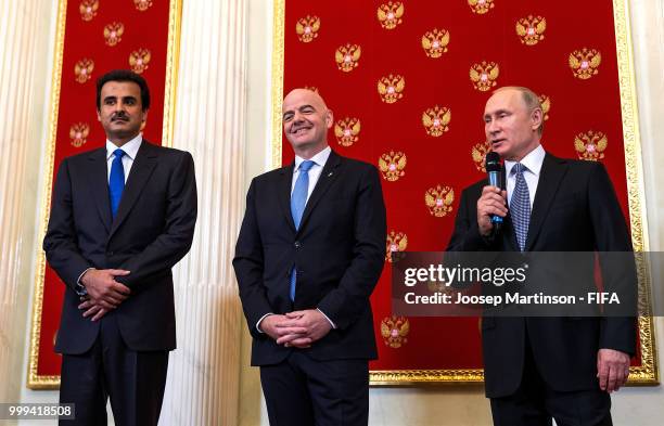 Amir of Qatar Sheikh Tamim bin Hamad Al Thani, FIFA president Gianni Infantino and President of Russia Valdimir Putin participate in a handover...