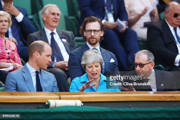 Prince William, Duke of Cambridge speaks with British Prime Minister Theresa May and her husband Philip May as they attend the Men's Singles final on...
