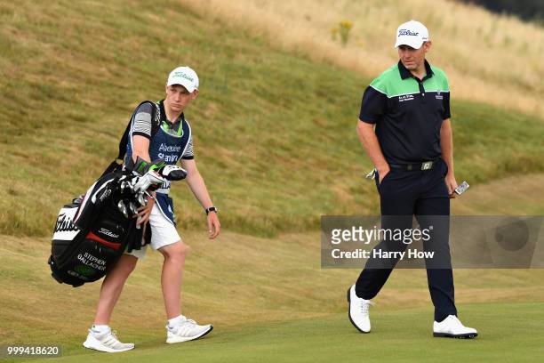Stephen Gallacher of Scotland looks on with his caddy, son Jack Gallacher on hole one during day four of the Aberdeen Standard Investments Scottish...