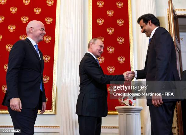 Amir of Qatar Sheikh Tamim bin Hamad Al Thani , FIFA president Gianni Infantino and President of Russia Valdimir Putin participate in a handover...