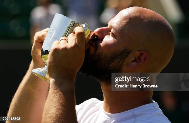 July 15: Stefan Olsson of Sweden with the trophy after winning the mens wheelchair final against Gustavo Fernandez of Argentina at the All England...