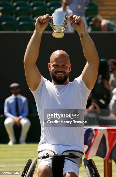 July 15: Stefan Olsson of Sweden with the trophy after winning the mens wheelchair final against Gustavo Fernandez of Argentina at the All England...