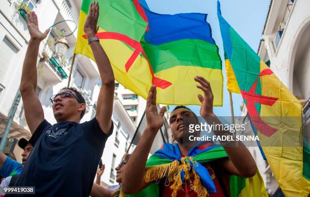 Moroccan demonstrators shout slogans as they protest on July 15 against the jailing of leaders and activists of a northern protest movement, in the...