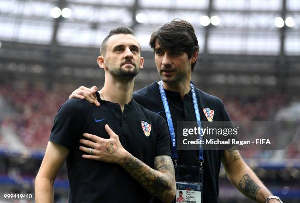 Marcelo Brozovic and Vedran Corluka of Croatia look on during a pitch inspection prior to the 2018 FIFA World Cup Final between France and Croatia at...