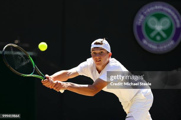 Jack Draper of Great Britain returns against Chun Hsin Tseng of Taiwan during the Boys' Singles final on day thirteen of the Wimbledon Lawn Tennis...
