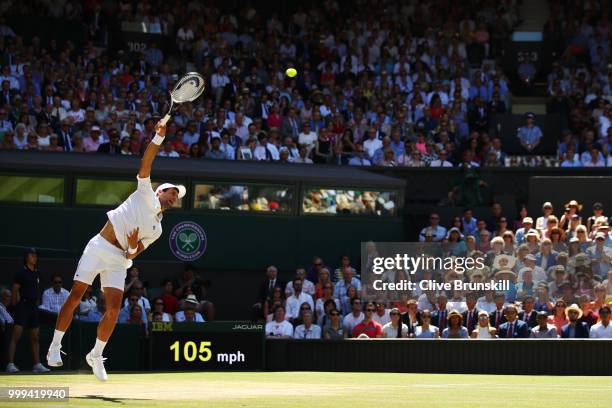 Novak Djokovic of Serbia serves against Kevin Anderson of South Africa during the Men's Singles final on day thirteen of the Wimbledon Lawn Tennis...