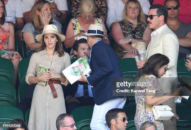 Emma Watson, John Vosler and Luke Evans attend the men's singles final on day thirteen of the Wimbledon Tennis Championships at the All England Lawn...