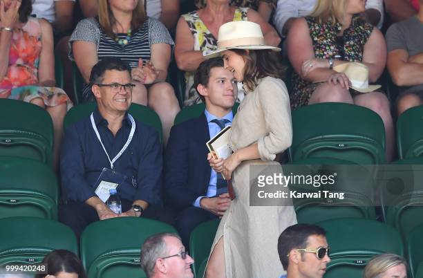 Tom Holland and and his father Dominic Holland and Emma Watson attend the men's singles final on day thirteen of the Wimbledon Tennis Championships...