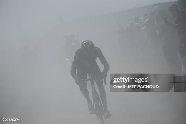 France's Damien Gaudin leads a two-men breakaway through the dust of a cobblestone section during the ninth stage of the 105th edition of the Tour de...