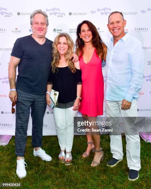 Phil Sarna, Lori Sarna, Julie Tell and Mark Tell attend The Samuel Waxman Cancer Research Foundation 14th Annual The Hamptons Happening on July 14,...