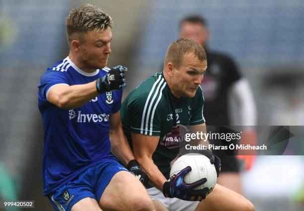 Dublin , Ireland - 15 July 2018; Peter Kelly of Kildare gathers possession, ahead of Conor McCarthy of Monaghan before the umpire ruled he had...