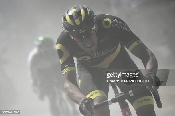 France's Damien Gaudin leads a two-men breakaway through the dust of a cobblestone section during the ninth stage of the 105th edition of the Tour de...