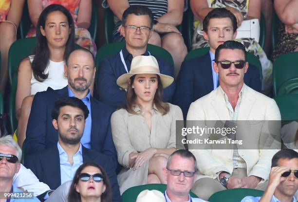 Dominic Holland and Tom Holland and John Vosler, Emma Watson and Luke Evans attend the men's singles final on day thirteen of the Wimbledon Tennis...