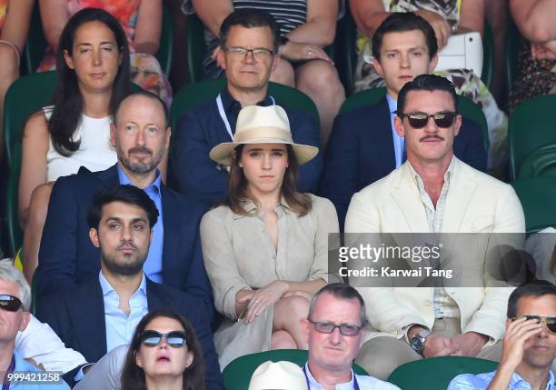 Dominic Holland and Tom Holland and John Vosler, Emma Watson and Luke Evans attend the men's singles final on day thirteen of the Wimbledon Tennis...