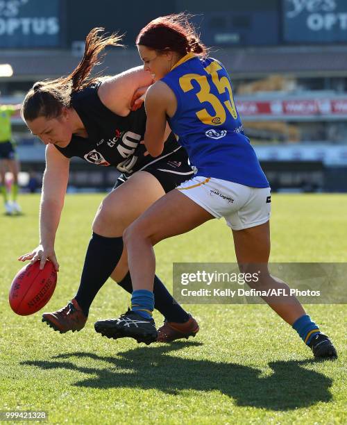 Kristi Harvey of the Blues and Jenna Bruton of the Seagulls compete for the ball during the round 10 VFLW match between Carlton Blues and...