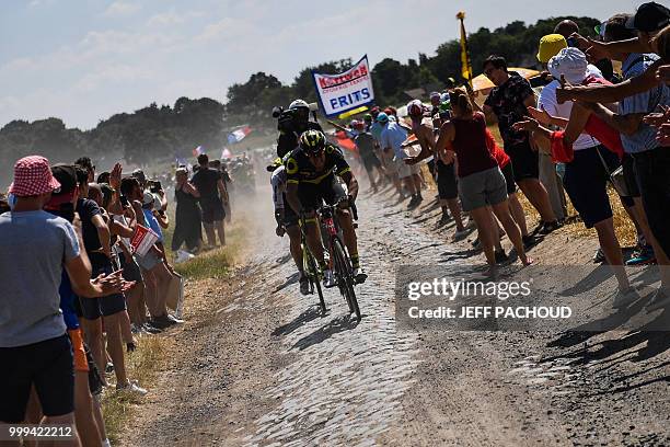 France's Damien Gaudin leads a two-men breakaway through a cobblestone section during the ninth stage of the 105th edition of the Tour de France...