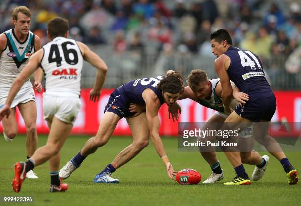 Alex Pearce of the Dockers and Ollie Wines of the Power contest for the ball during the round 17 AFL match between the Fremantle Dockers and the Port...
